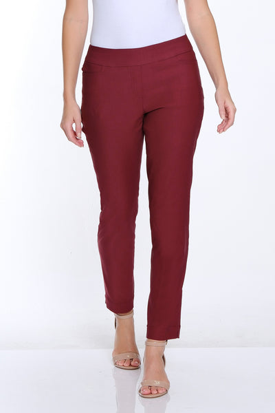 Woman wearing a white t-shirt and red pants on a white background