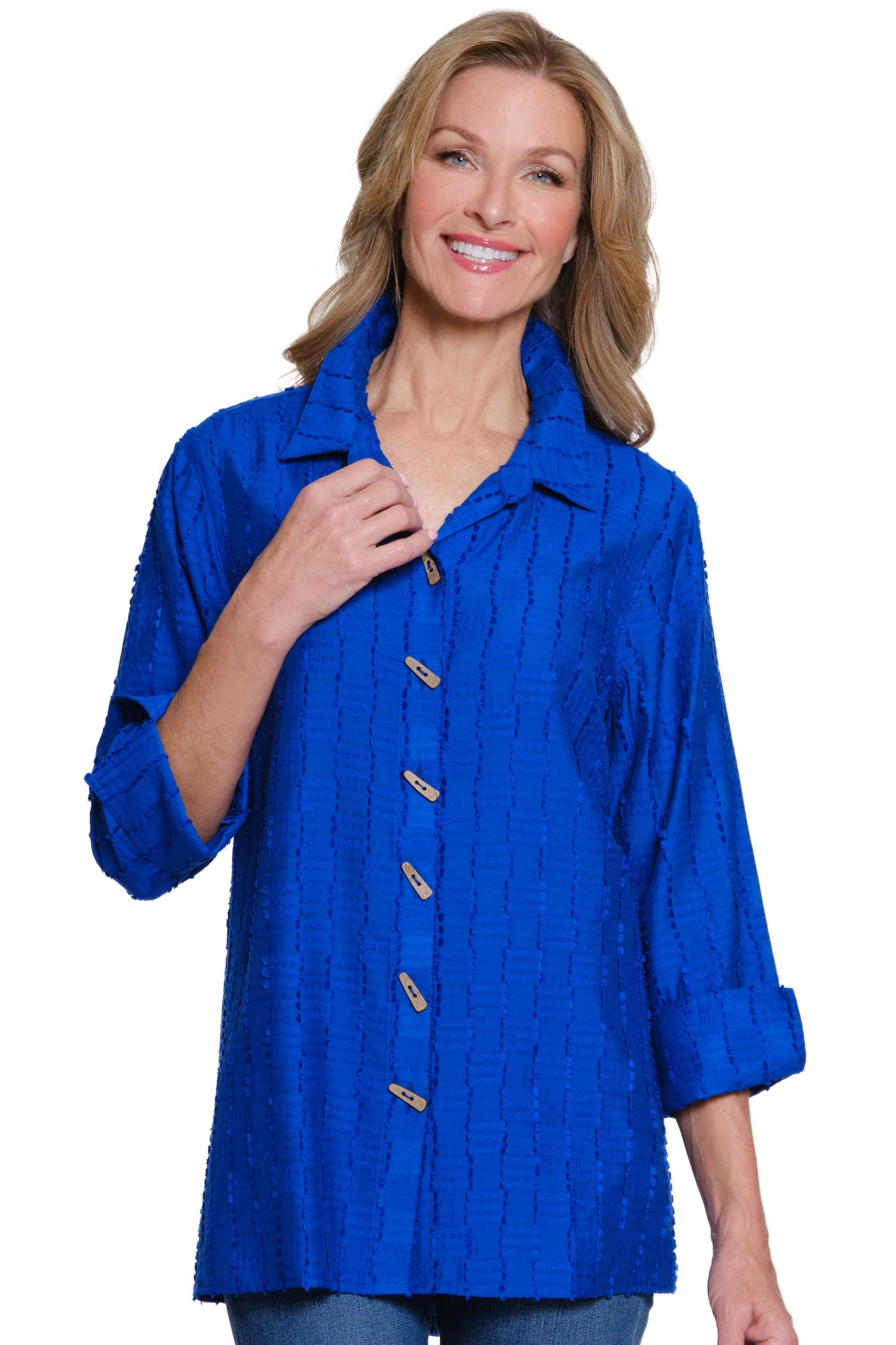 Woman wearing a blue shirt with buttons on a white background