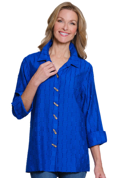 Woman wearing a blue button-up shirt on a white background