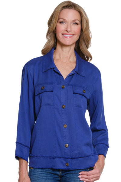 Woman wearing a blue jacket with button details on a white background