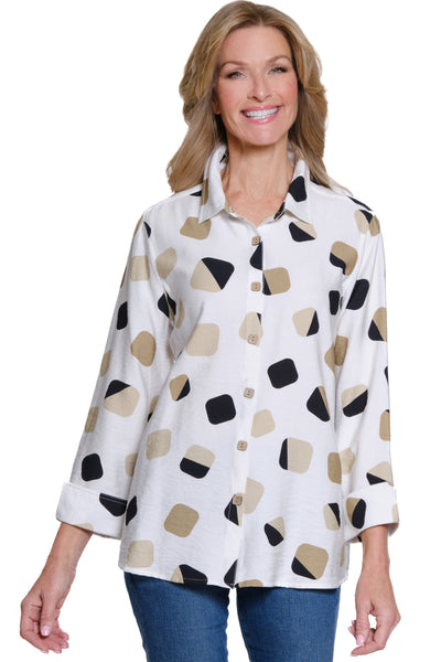 Woman wearing a white blouse with black and beige pattern on a white background