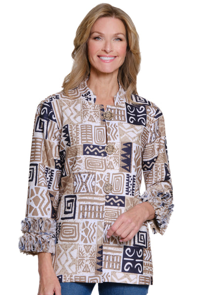 Woman wearing a patterned long-sleeve shirt on a white background