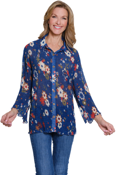 Woman wearing a blue floral blouse on a white background