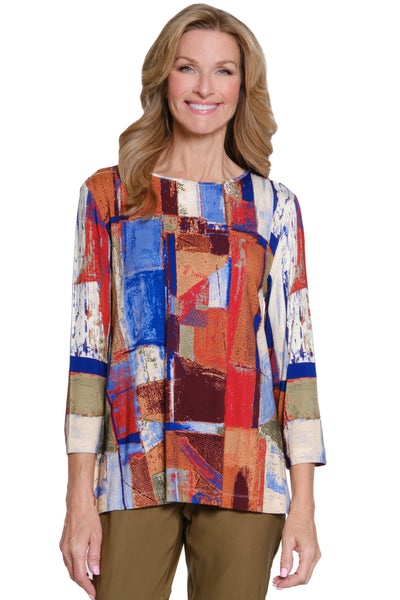 Woman wearing a colorful patterned top on a white background