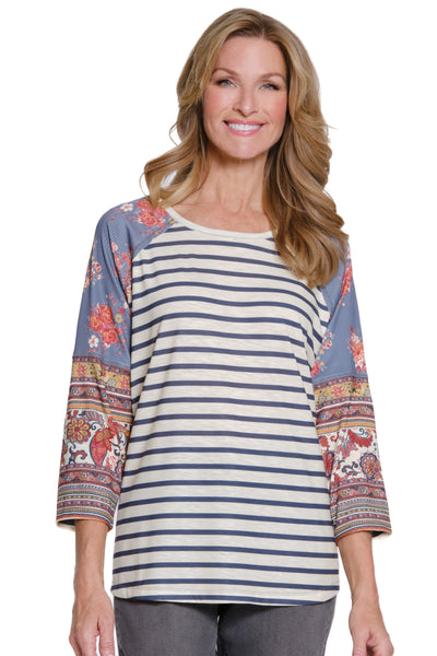 Woman wearing a striped shirt with colorful sleeves on a white background