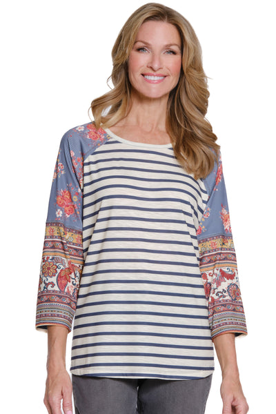 Woman wearing a striped shirt with colorful sleeves on a white background