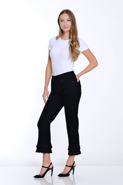 Woman wearing a white t-shirt and black pants on a white background