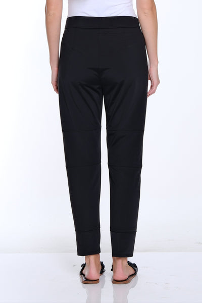 Person wearing a white t-shirt and black pants on a white background