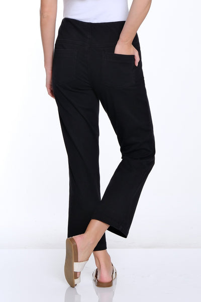 Woman wearing a white t-shirt and black pants on a white background