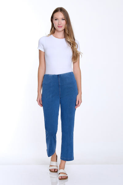 Woman wearing a white t-shirt and blue pants on a white background