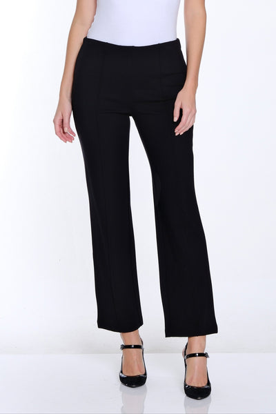 Woman wearing a white t-shirt and black pants on a white background