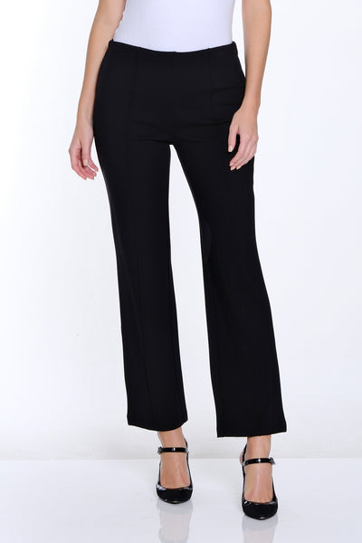 Woman wearing a white t-shirt and black pants on a white background