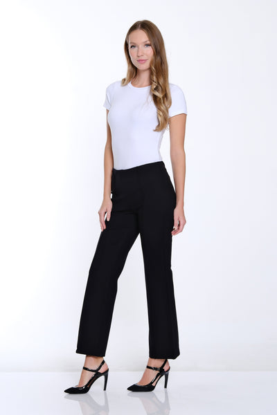 Woman wearing a white t-shirt and black pants on a white background