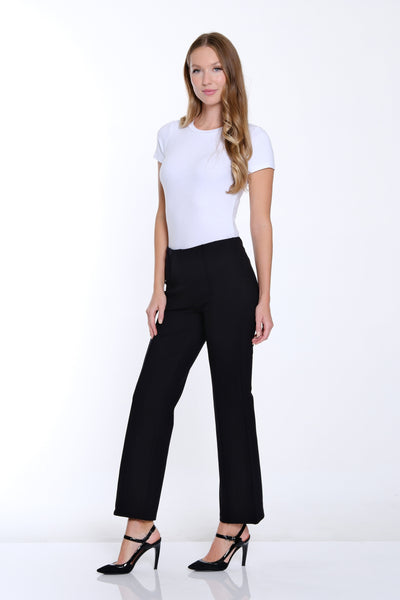 Woman wearing a white t-shirt and black pants on a white background