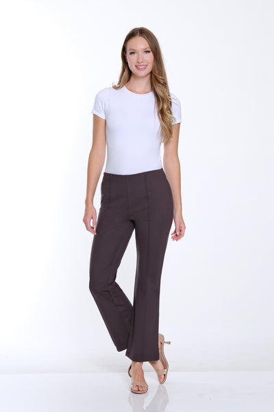 Woman wearing a white t-shirt and brown pants on a white background