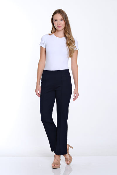 Woman wearing a white t-shirt and black pants on a white background