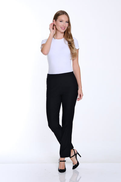 Woman wearing a white t-shirt and black pants on a white background