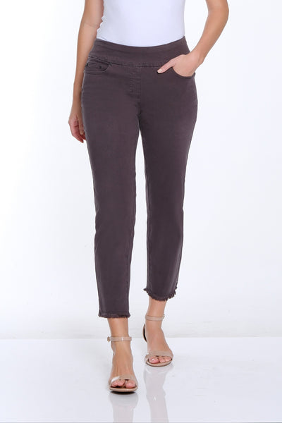Woman wearing a white t-shirt and brown pants on a white background