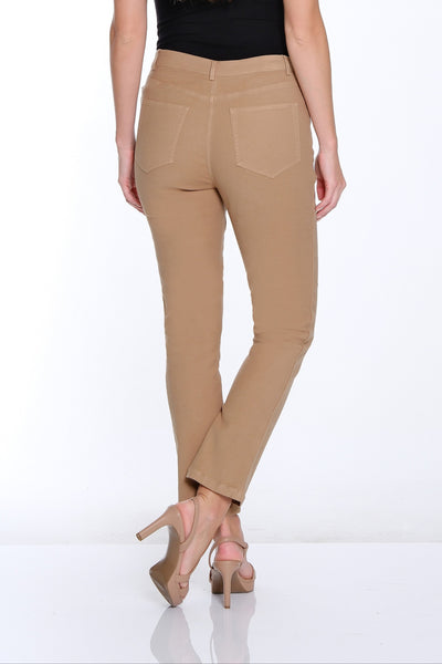Woman wearing beige pants and a black top on a white background