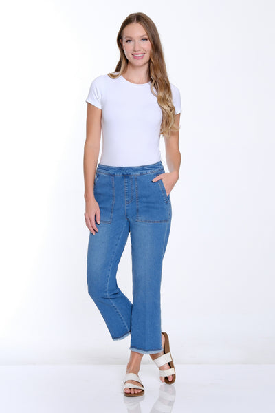 Woman wearing blue jeans and a white t-shirt on a white background