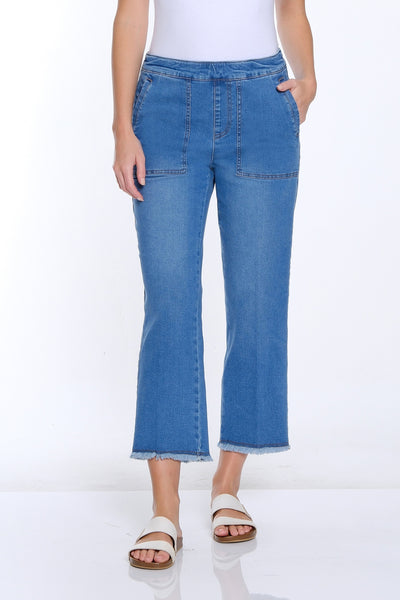 Woman wearing a white t-shirt and blue jeans on a white background