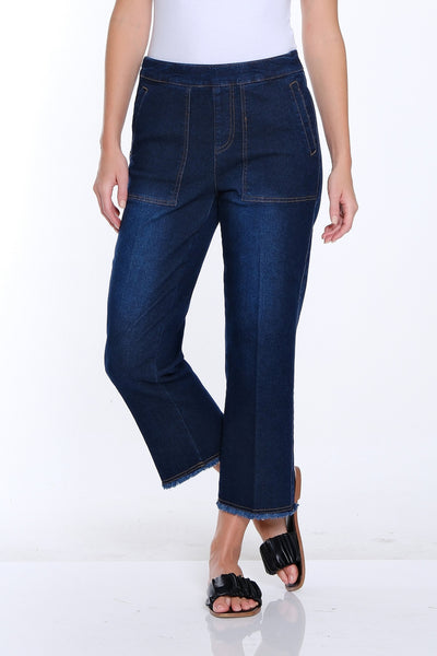 Woman wearing a white t-shirt and blue jeans on a white background