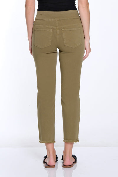 Woman wearing olive green pants and a black top on a white background