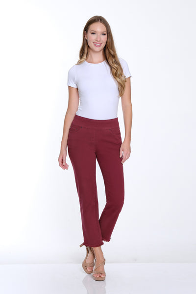 Woman wearing a white top and red pants on a white background