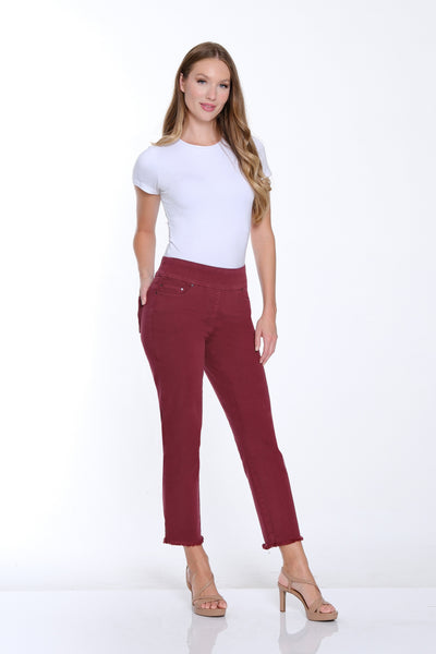 Woman wearing a white t-shirt and red pants on a white background