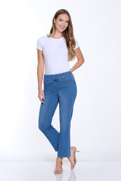 Woman wearing a white t-shirt and blue jeans on a white background
