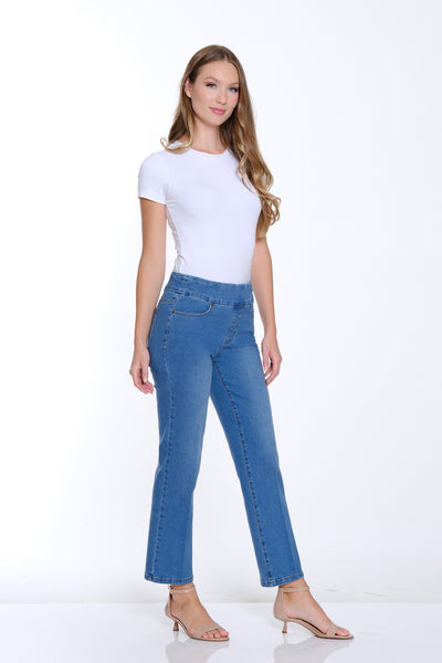 Woman wearing a white t-shirt and blue jeans on a white background