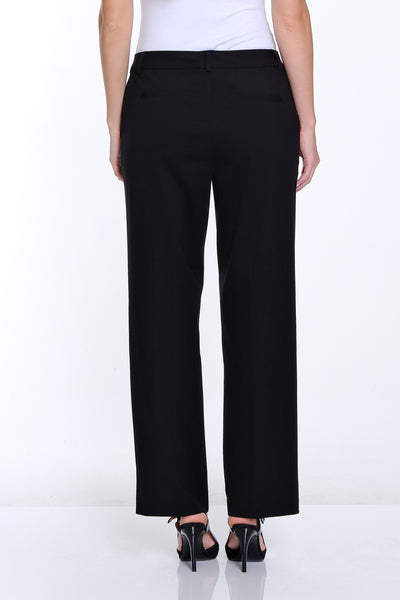 Person wearing a white top and black pants on a white background