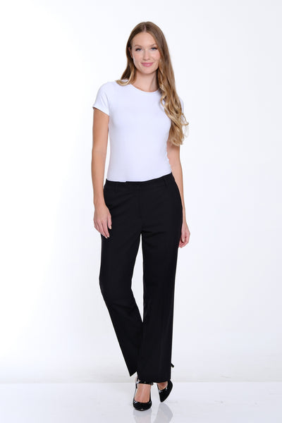 Woman wearing a white t-shirt and black pants on a white background
