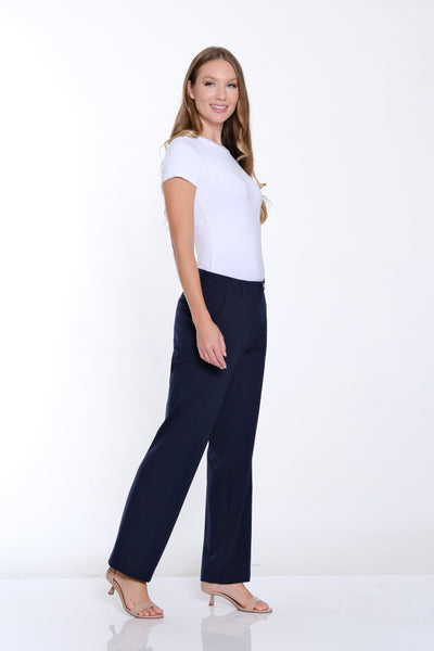 Woman wearing a white t-shirt and navy pants on a white background