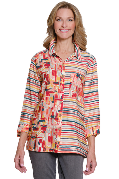 Woman wearing a colorful patterned shirt on a white background