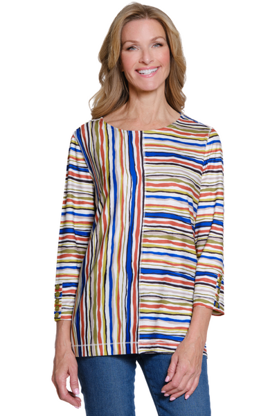Woman wearing a colorful striped shirt on a white background